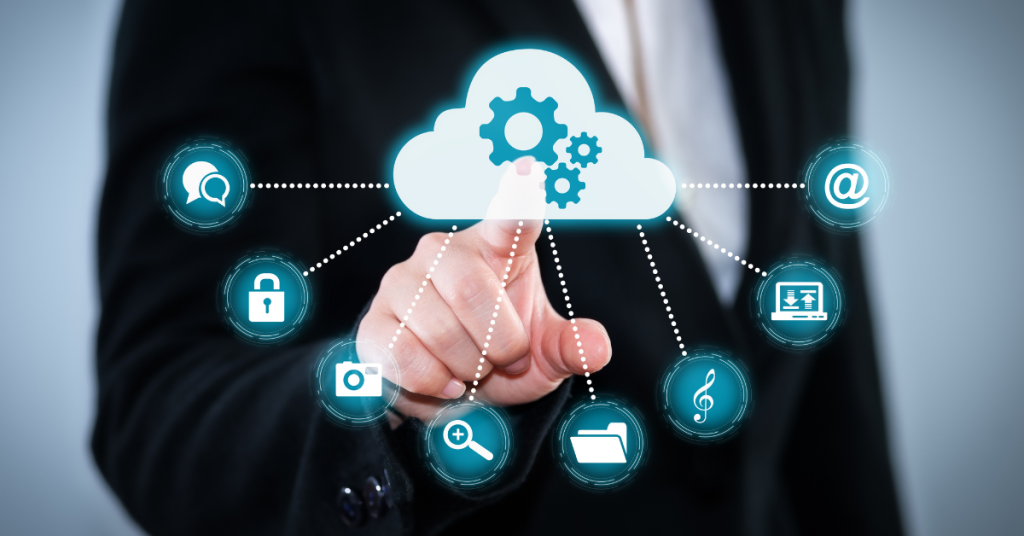 Finger pointing on the screen where there is a picture of cloud and its services